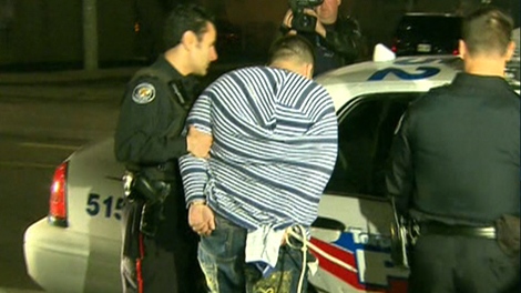 Toronto police conduct raids in the Shuter and River Streets area of Regent Park, early Thursday, Oct. 22, 2009.