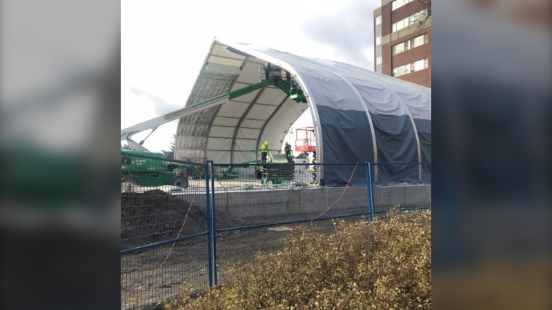 Work continues on a temporary hospital unit in the parking lot at the Ottawa Hospital Civic Campus. (John Crupi/CTV News Ottawa)