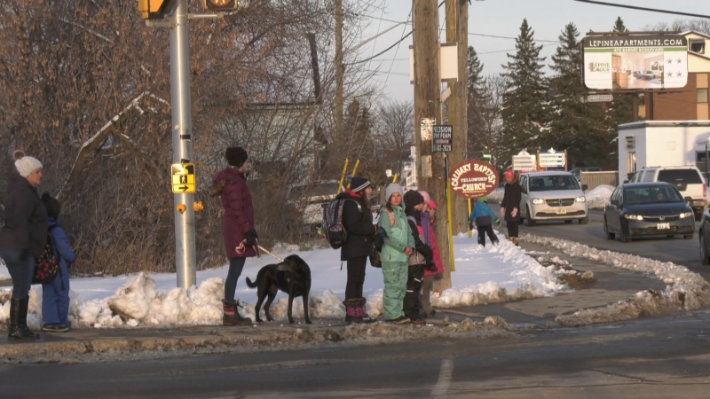 Students wait to cross the street at the intersection of Daniel Street and Edey Street in Arnprior.