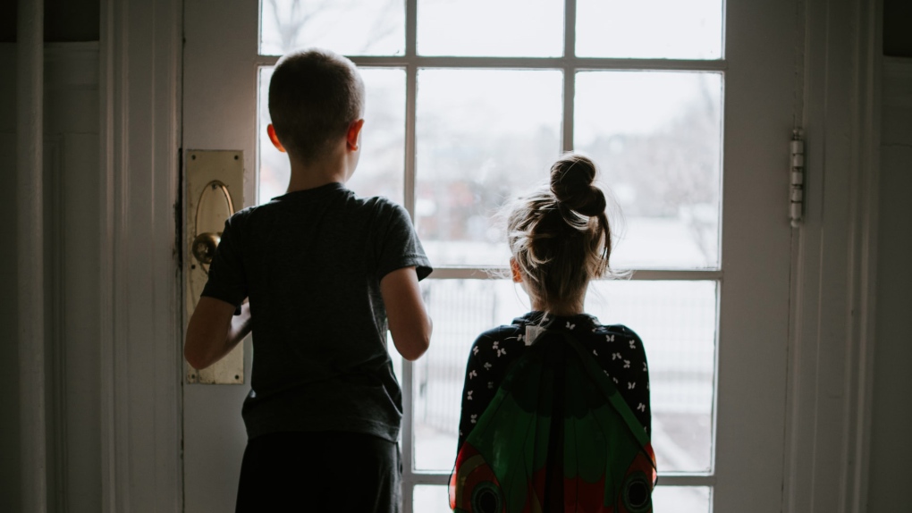 Kids looking outside during a pandemic quarantine