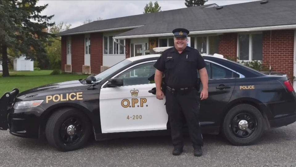 Const. Marc Hovingh in front of his OPP cruiser