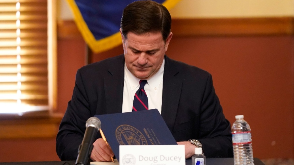 Arizona Gov. Doug Ducey signs election documents