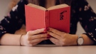 A woman is seen reading a book in this undated stock image. (Photo by freestocks.org from Pexels)
