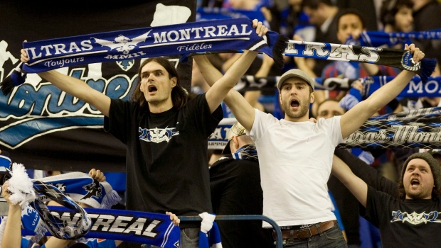 Montreal Impact fans cheer on their team following the Impact's MLS home opener soccer game against the Chicago Fire in Montreal, Saturday, March 17, 2012. THE CANADIAN PRESS/Graham Hughes