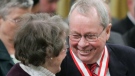 Former Toronto Mayor David Crombie of Toronto, (right) laughs with Budge Wilson of Halifax, N.S. after receiving the Order of Canada during a ceremony at Rideau Hall in Ottawa Friday, March 11, 2005. (CP PHOTO/Jonathan Hayward)