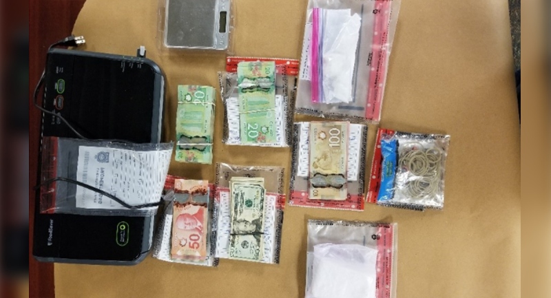 Drugs and cash seized by London police are seen in this image released Monday, Dec. 7, 2020. (Source: London Police Service)