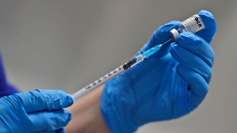 FILE - A nurse prepares to administer the Pfizer-BioNTech COVID-19 vaccine at Guy's Hospital in London, Tuesday, Dec. 8, 2020. (AP / Frank Augstein, Pool)