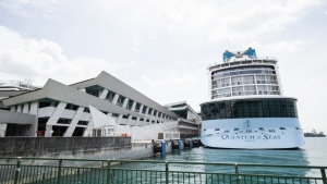 The Quantum of the Seas cruise ship is docked at the Marina Bay Cruise Center Wednesday, Dec. 9, 2020 in Singapore. (AP Photo/Danial Hakim)