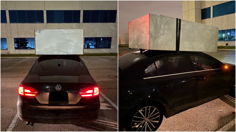 Police say they caught a driver in Mississauga, Ont. with a massive dresser attached to his roof with only a piece of tape. (Peel Regional Police)