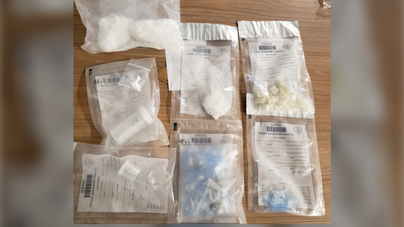 OPP says it seized drugs, including 450g of cocaine and over 60g of fentanyl, plus cash during a search warrant in Orillia on Thurs., Dec. 10, 2020. (Supplied)