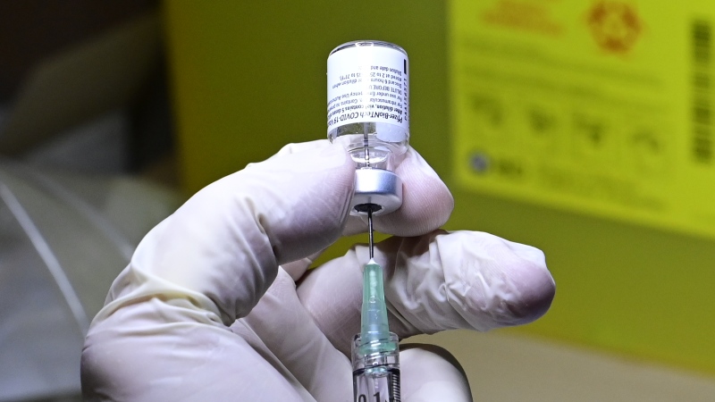 A COVID-19 vaccine is prepared to be administered at a hospital in Toronto on Monday, Dec. 14, 2020. THE CANADIAN PRESS/Frank Gunn
