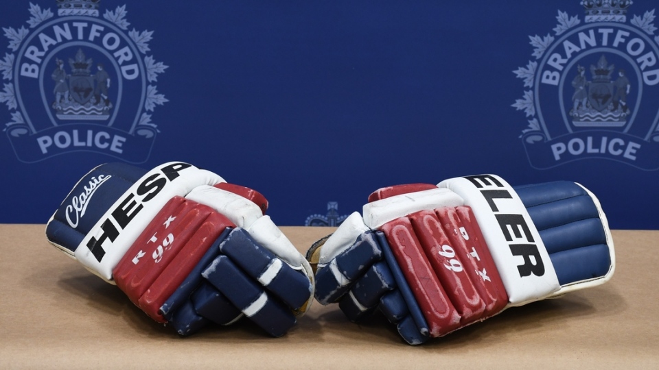 A pair of scuffed hockey gloves