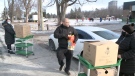 Gregory Aboukheir delivers meals and gifts to children at Dr. F.J. McDonald Catholic School in Ottawa. Dec. 15, 2020. (Jim O'Grady / CTV News Ottawa)