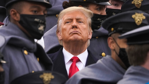 Surrounded by Army cadets, U.S. President Donald Trump watches the first half of the 121st Army-Navy Football Game in Michie Stadium at the United States Military Academy, Saturday, Dec. 12, 2020, in West Point, N.Y. (AP Photo/Andrew Harnik)
