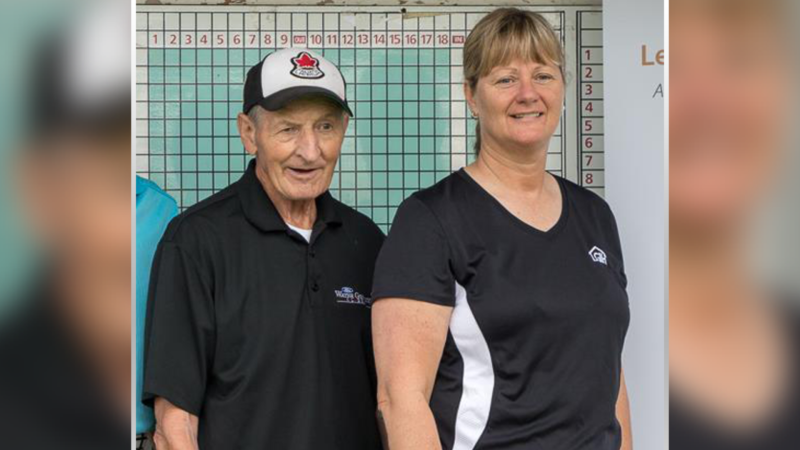 Senior OPP officer June Dobson, right, at a 2014 charity golf tournament with Walter Gretzky. Dobson has been charged with fraud in relation to the alleged theft of Wayne Gretzky memorabilia from Walter Gretzky's Brantford, Ont. home. (Source: Leeds & Grenville Interval House)