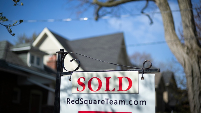 A real estate sold sign is shown in a Toronto west end neighbourhood May 17, 2020. THE CANADIAN PRESS/Graeme Roy