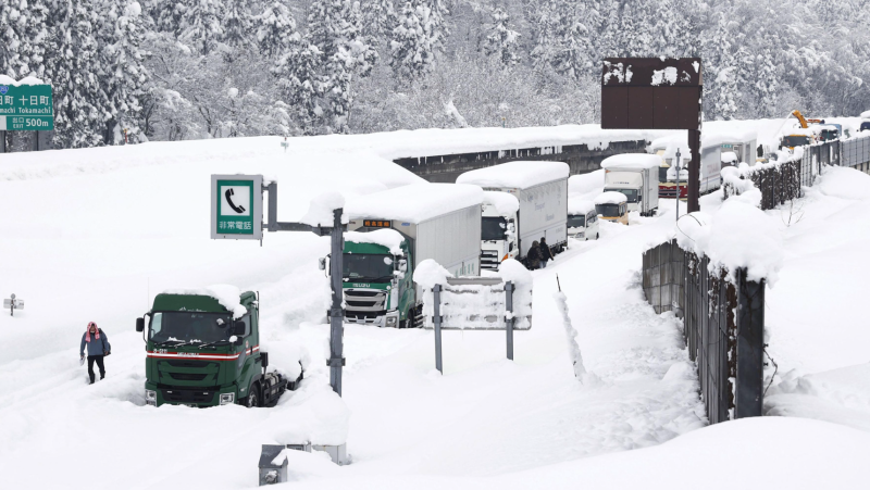 More than a thousand vehicles were left stranded overnight on a highway in Japan after the country was hit by a massive snowstorm.