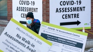 A man exits a COVID19 Assesment Centre in Toronto on Friday, Dec. 18, 2020. THE CANADIAN PRESS/Frank Gunn