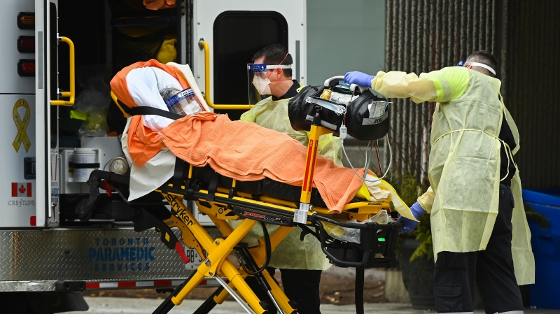 Paramedics take away an elderly patient at the Tendercare Living Centre, long-term-care facility during the COVID-19 pandemic in Scarborough, Ont., on Wednesday, December 23, 2020.  THE CANADIAN PRESS/Nathan Denette