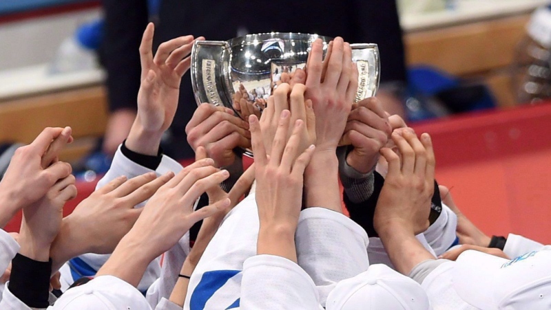 Finland players reach for the trophy as they celebrate their gold medal game win at the IIHF World Junior Championship in Helsinki, Finland on Tuesday, Jan 5, 2016. Finland defeated Russia 4-3 in sudden-death overtime. THE CANADIAN PRESS/Sean Kilpatrick