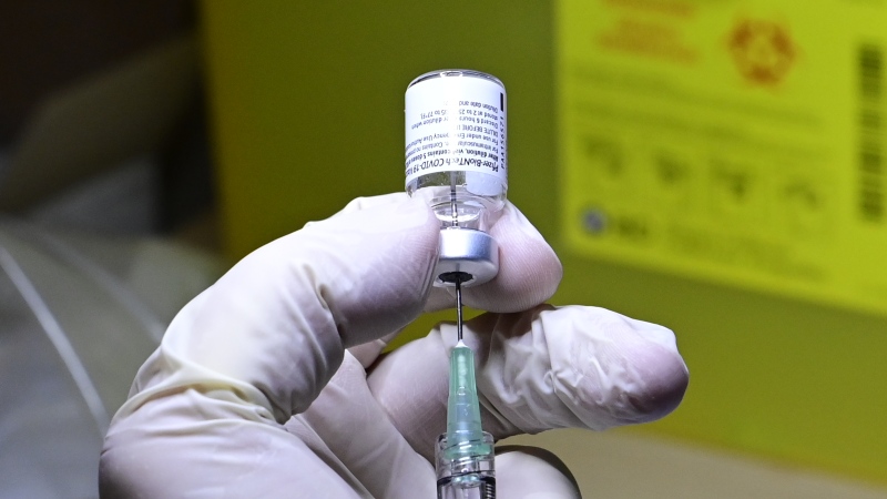 A COVID-19 vaccine is prepared to be administered at a hospital in Toronto on Monday, Dec. 14, 2020. THE CANADIAN PRESS/Frank Gunn