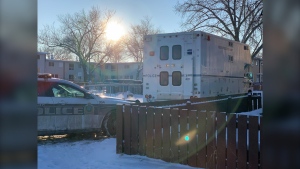 Winnipeg police remain on the scene of a "serious incident" in the 1600 block of Burrows Avenue on Dec. 30, 2020 (CTV News Photo Jamie Dowsett)