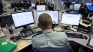 A worker takes a 911 call at the RCMP F Division Operational Communication Command Centre on Thursday, Sept. 16, 2010, in Regina, Sask. THE CANADIAN PRESS/Troy Fleece
