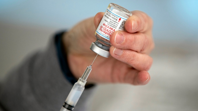 A nurse prepares a dose of the COVID-19 vaccine on Thursday, Dec. 31, 2020, in Wayne, W.Va. (Sholten Singer/The Herald-Dispatch via AP)