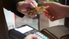 A credit card transaction taking place. (Courtesy of Pexels)