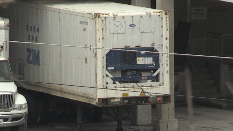 A refrigerated trailer is seen parked in the loading area at the London Health Sciences Centre in London, Ont. on Tuesday, Jan. 5, 2021. (Jim Knight / CTV News)