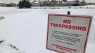 A 'no trespassing' sign was erected near a storm water pond in the Stonebridge area of Barrhaven that had become a popular place for area children to skate. The property owner, Mattamy Homes, says the pond is unsafe for skating. (Dave Charbonneau / CTV News Ottawa)
