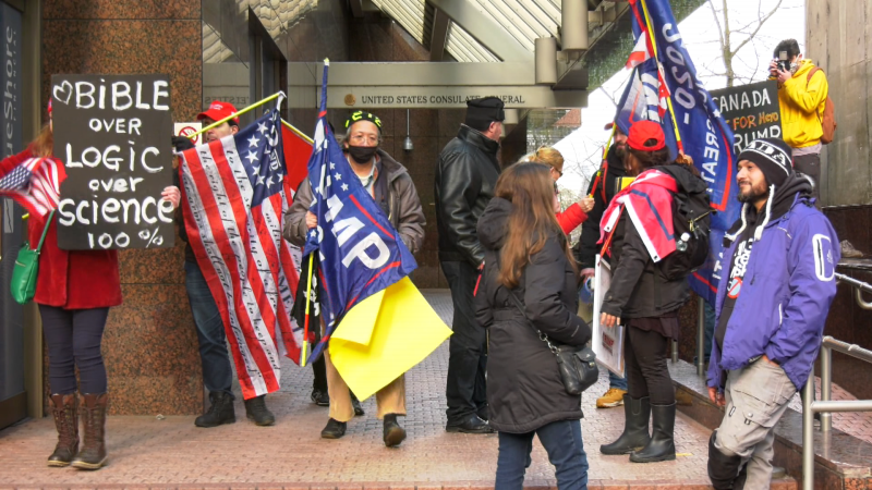 A group of Donald Trump supporters are seen outside the U.S. consulate in downtown Vancouver on Jan. 6, 2020. Afterwards, a mostly peaceful rally of about two dozen people turned violent when a man attacked a CBC News journalist. 