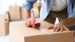 Person with a moving box is seen in this undated photo. (Shutterstock)