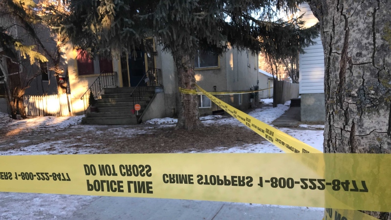 Police tape surrounds a home in south Edmonton where two bodies were found on Jan. 6, 2021. 