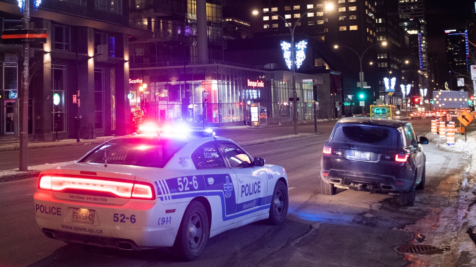 A car is pulled over during curfew in Montreal