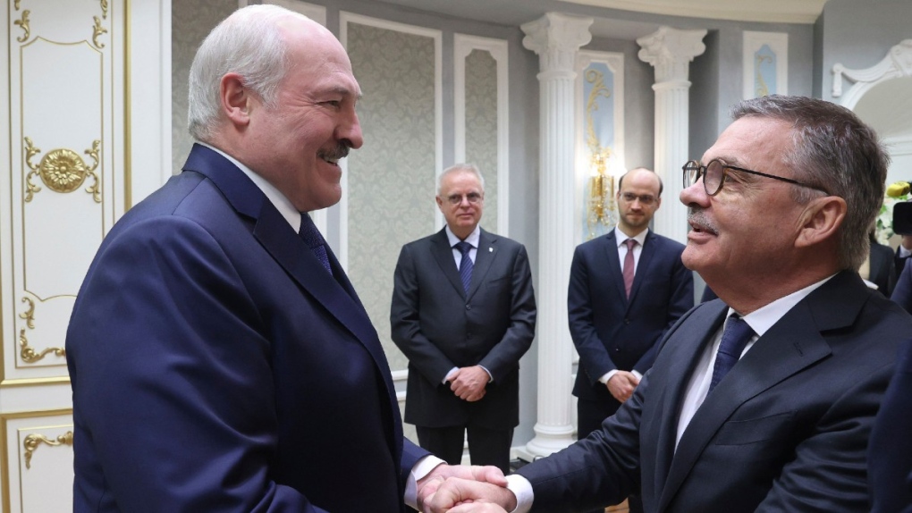 Alexander Lukashenko, left, greets Rene Fasel