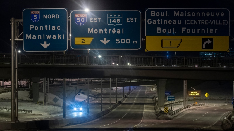 A car leaves Gatineau as it heads in to Ontario Saturday, Jan. 9, 2021 as a province wide curfew begins. The province implemented a curfew in efforts to reduce COVID-19 cases. (Adrian Wyld/THE CANADIAN PRESS)