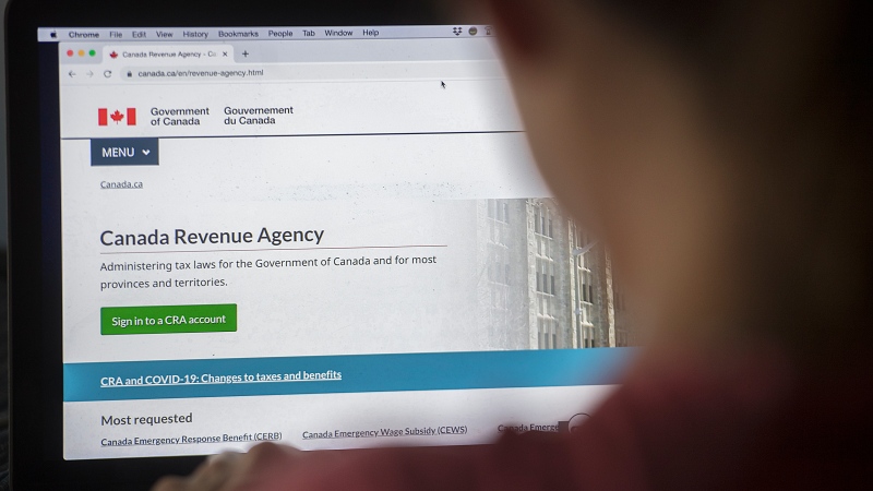 A person looks at a Canada Revenue Agency homepage in Montreal, Sunday, August 16, 2020, as the COVID-19 pandemic continues in Canada and around the world. (THE CANADIAN PRESS/Graham Hughes)