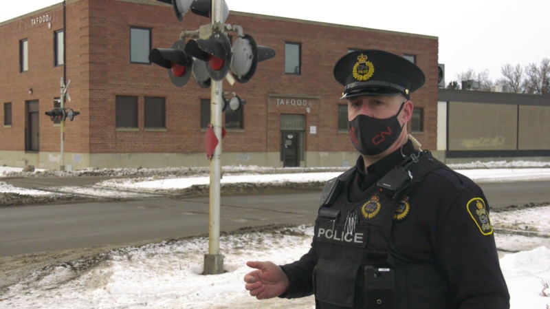 Cst. Hank Neumiller with the CN Railway Police is pictured at the Broadway St. rail crossing in Yorkton. (Kaylyn Whibbs / CTV NEWS)
