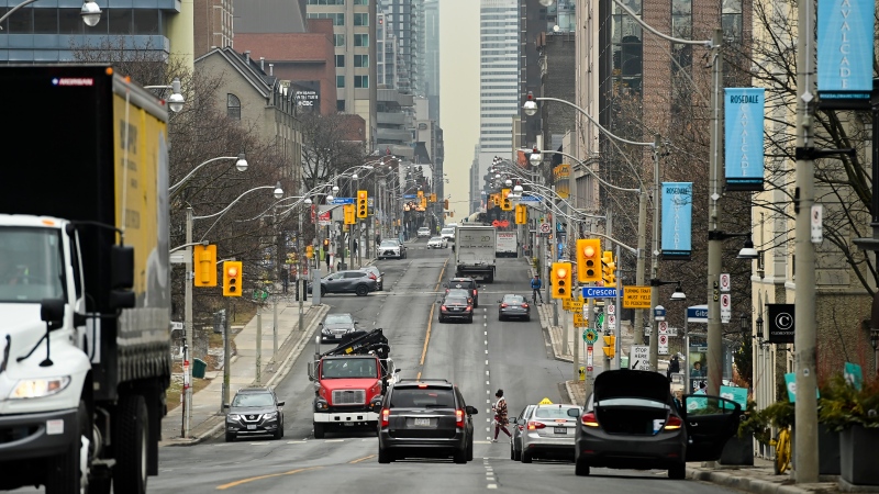 Traffic moves along Yonge Street during the COVID-19 pandemic in Toronto on Thursday, January 14, 2021. The province of Ontario is currently under an emergency order lockdown. THE CANADIAN PRESS/Nathan Denette