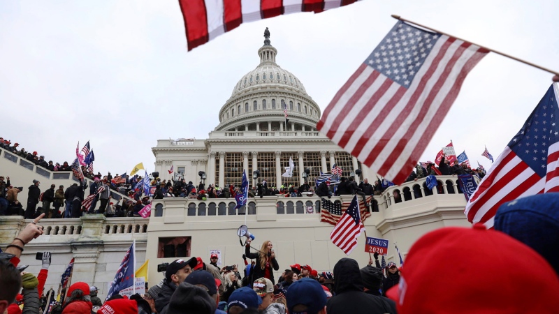In this Wednesday, Jan. 6, 2021 file photo, supporters of former President Donald Trump gather outside the U.S. Capitol in Washington. (AP Photo/Shafkat Anowar)