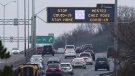 A highway sign notifies drivers to stay-home as they make their way along the Queensway in Ottawa on Thursday, Jan. 14, 2021. (Sean Kilpatrick/THE CANADIAN PRESS)