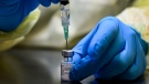 A health-care worker prepares a dose of the Pfizer-BioNTech COVID-19 vaccine at a UHN COVID-19 vaccine clinic in Toronto on Thursday, January 7, 2021. THE CANADIAN PRESS/Nathan Denette