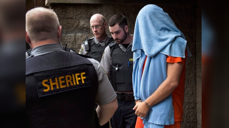 Jimmy Melvin Jr. is escorted from Nova Scotia provincial court in Halifax on Monday, July 20, 2015. Melvin faces first-degree murder charges related to the 2009 shooting death of Terry Marriott Jr. THE CANADIAN PRESS/Andrew Vaughan