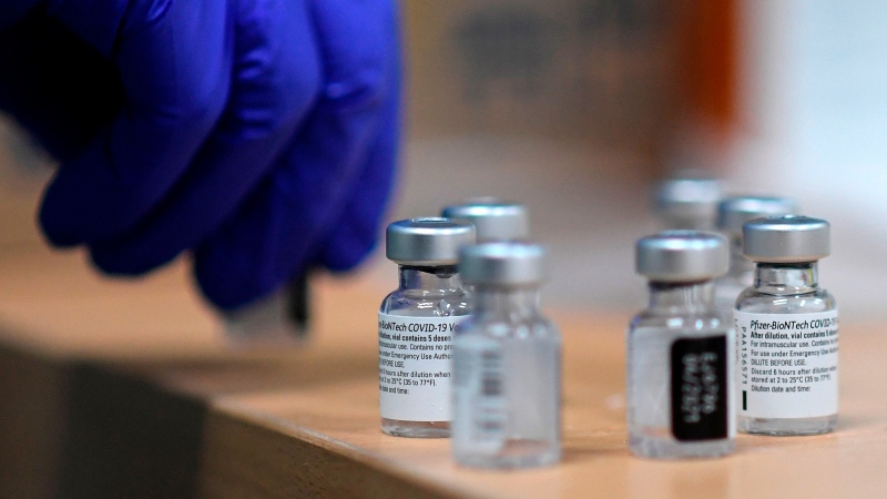 FILE - A health worker prepares a Pfizer-BioNTech COVID-19 vaccine during a vaccination campaign of members of the Emergency Medical Services of Madrid in Madrid on January 12. (Oscar del Pozo/AFP/Getty Images via CNN)