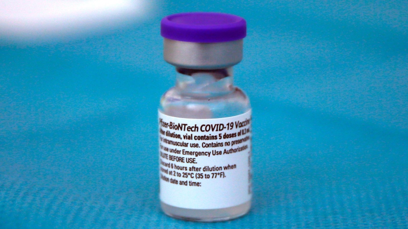 A vial with the Biontech/Pfizer vaccine against COVID-19 disease is ready at the vaccination center of the Dron hospital in Tourcoing, northern France, Tuesday, Jan. 19, 2021. (AP Photo/Michel Spingler)