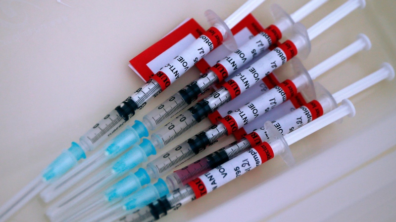 Syringes with the Biontech/Pfizer vaccine against COVID-19 are ready at the vaccination center of the Dron hospital in Tourcoing, northern France, Tuesday, Jan. 19, 2021. (AP Photo/Michel Spingler)