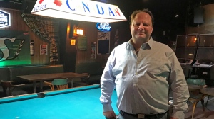 Kevin Citynski, the owner of the Jolly Roger Beer Store & Tavern stands next to a pool table inside of the iconic Regina bar. (Cally Stephanow/CTV News) 