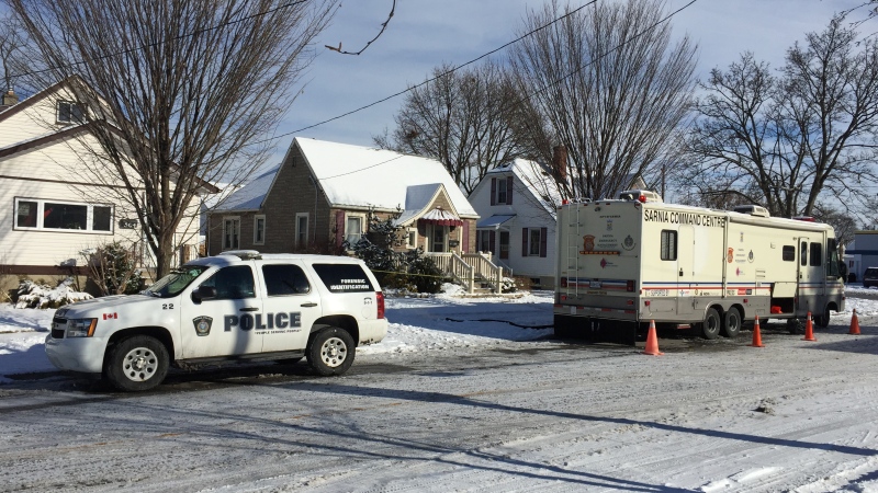 Police investigators work at the scene of a homicide at 566 Devine Street in Sarnia, Ont. on Wednesday, Jan. 27, 2021. (Bryan Bicknell / CTV News)