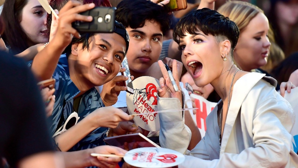Halsey poses for photos with fans in 2018